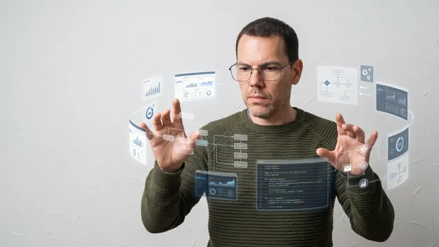 Philippe manipule des écrans virtuels flottants affichant du code, des graphiques et des schémas de processus